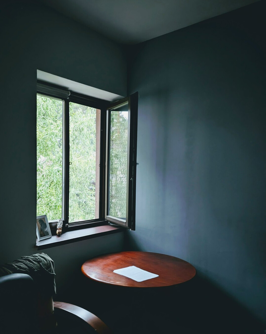 Home workspace with laptop near a window with natural light