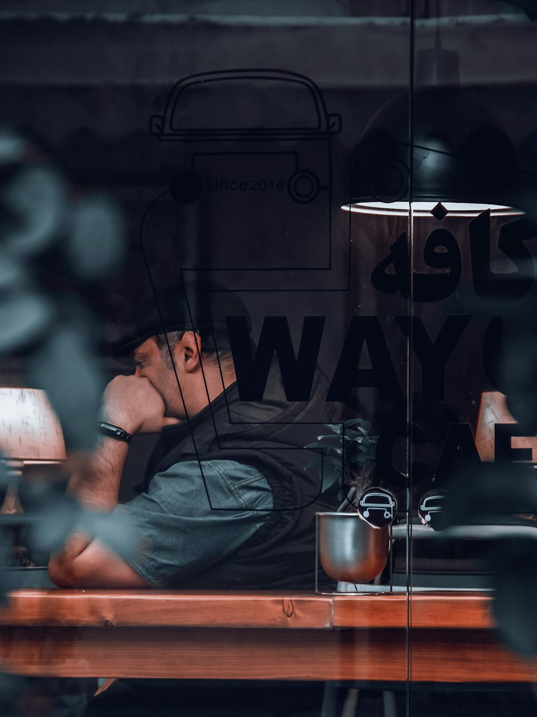 Young Croatian man working on a laptop in a cafe