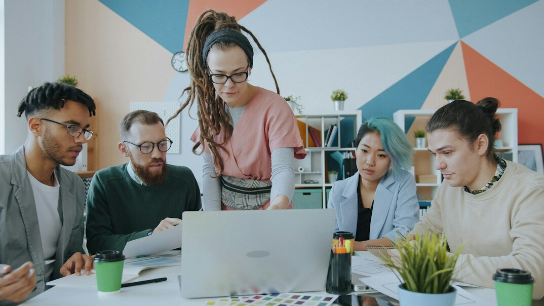 diverse group of young coders collaborating